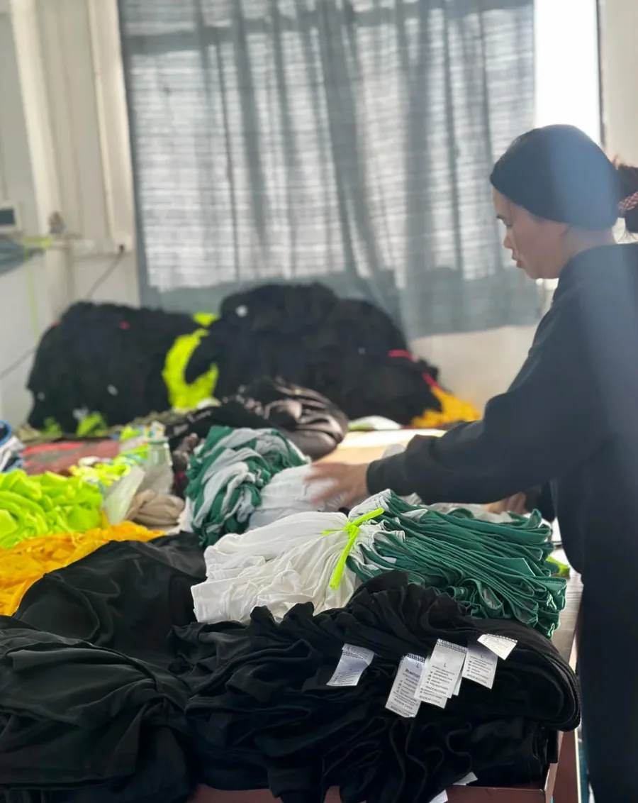 Garments being sorted during bulk jersey order preparation