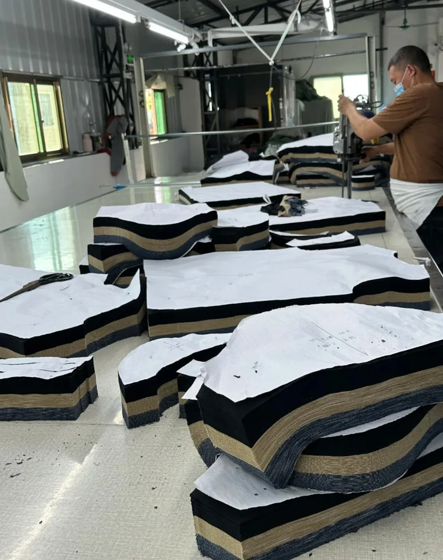 Cut jersey panels arranged on a production table