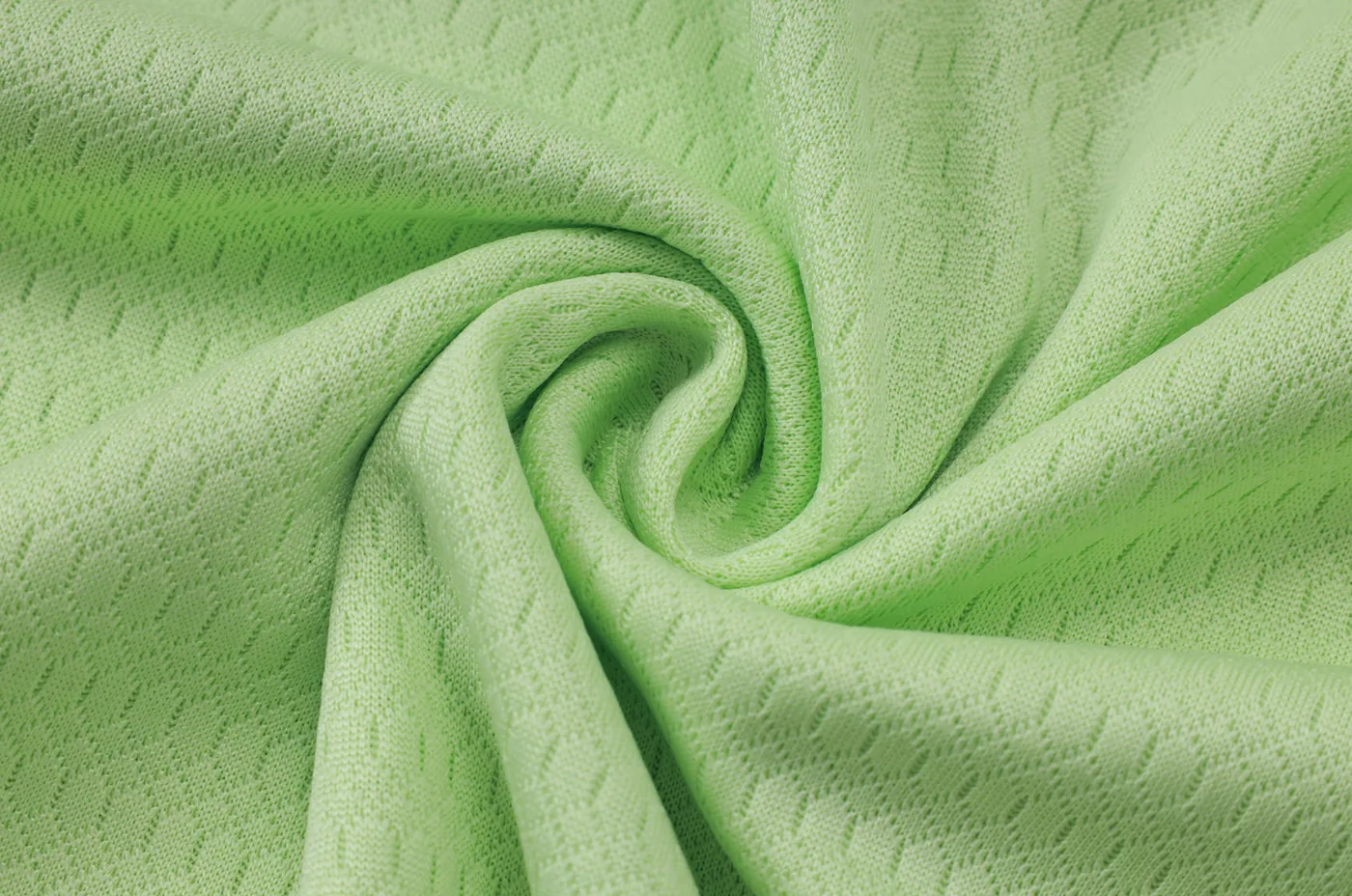 Close-up of breathable polyester fabric on a football training top